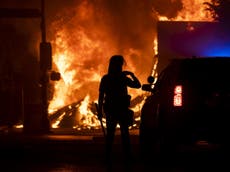 Charred body found in pawnshop that was set alight during protests