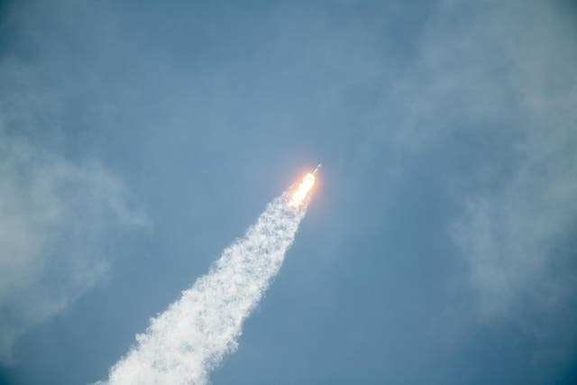 In this SpaceX handout image, a Falcon 9 rocket carrying the company's Crew Dragon spacecraft launches on the Demo-2 mission to the International Space Station with NASA astronauts Robert Behnken and Douglas Hurley onboard at Launch Complex 39A May 30, 2020, at the Kennedy Space Center