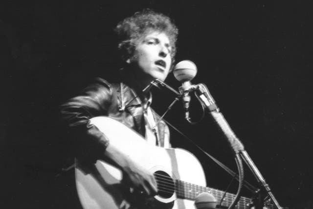 Bob Dylan performs at Rhode Island's Newport Folk Festival in July 1965