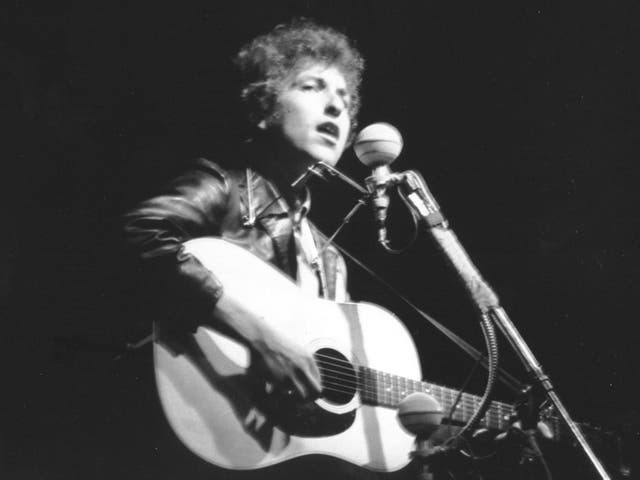 Bob Dylan performs at Rhode Island's Newport Folk Festival in July 1965