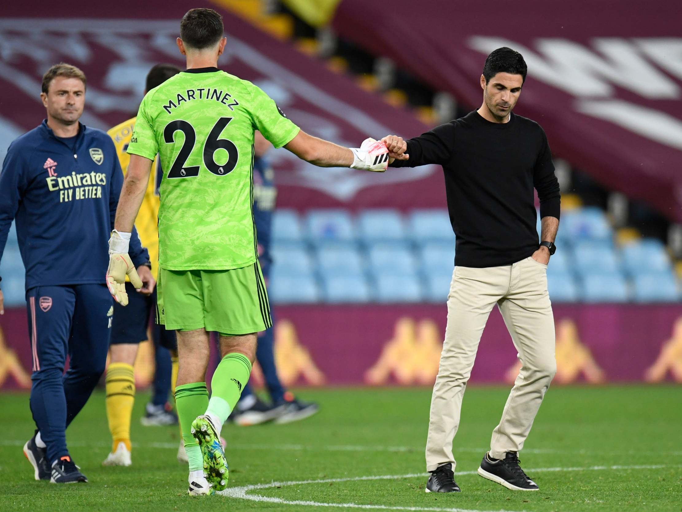 Mikel Arteta greets goalkeeper Emiliano Martinez at full-time