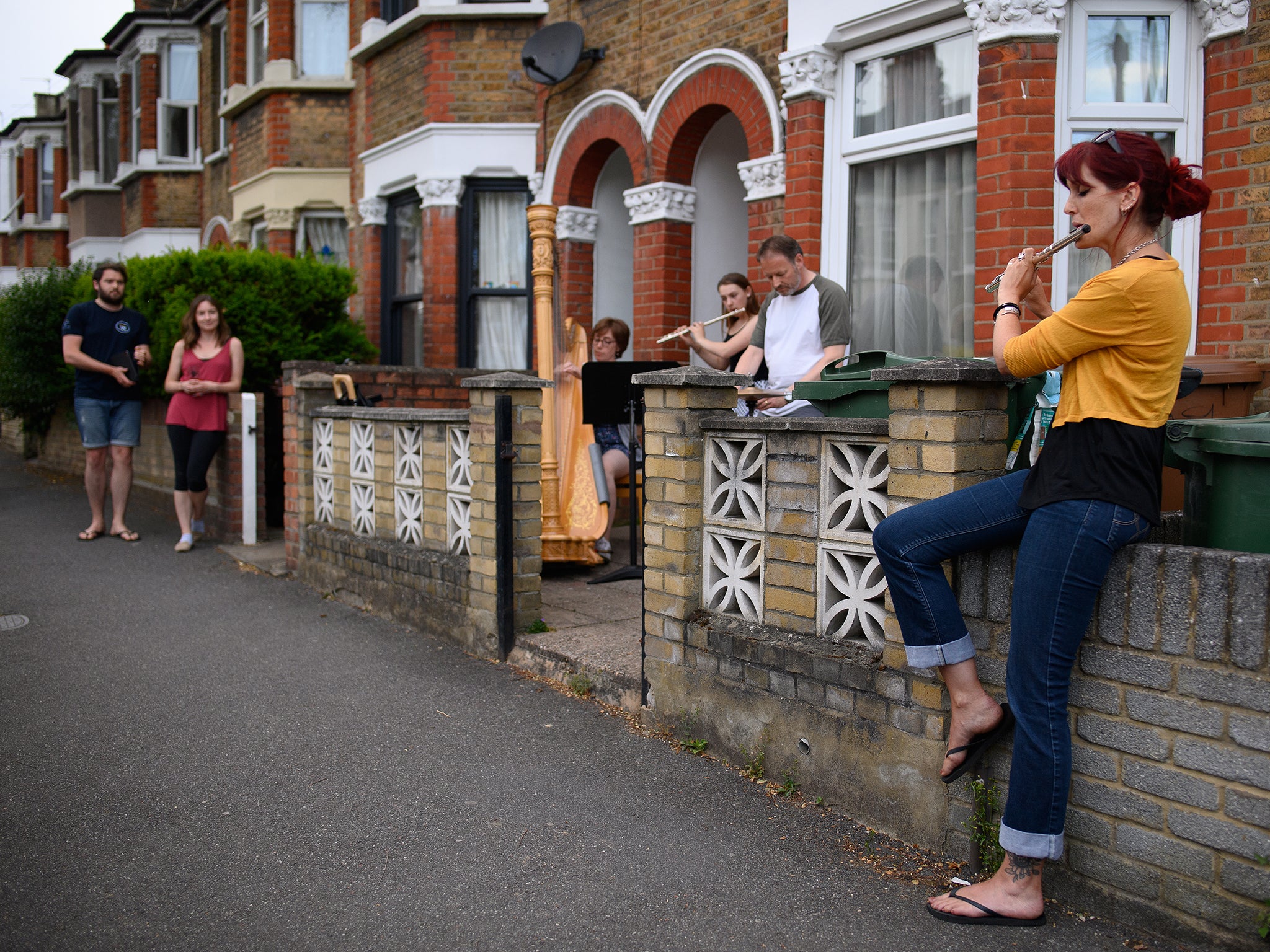 Neighbours perform music for residents of Walthamstow during a Clap for Carers Thursday in May