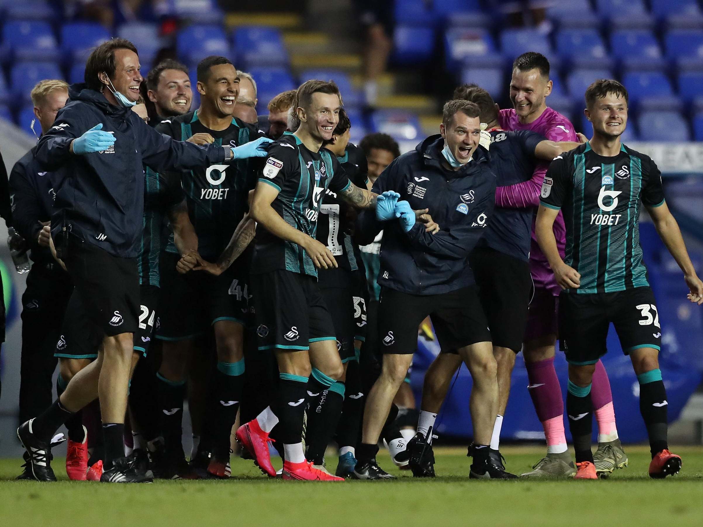 Swansea celebrate securing a play-off spot