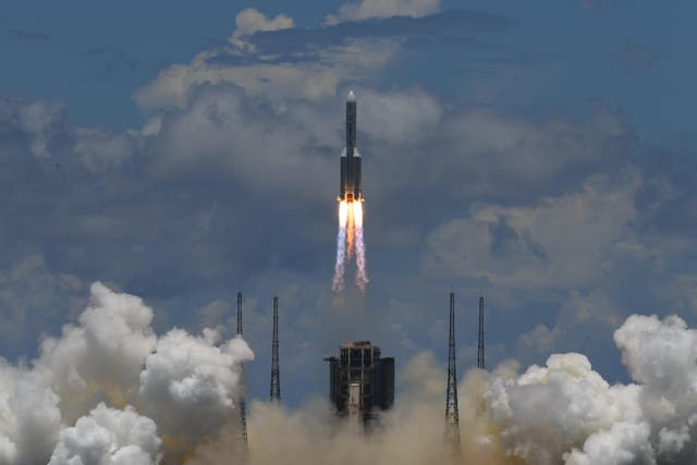 A Long March-5 rocket, carrying an orbiter, lander and rover as part of the Tianwen-1 mission to Mars, lifts off from the Wenchang Space Launch Centre in southern China's Hainan Province on July 23, 2020