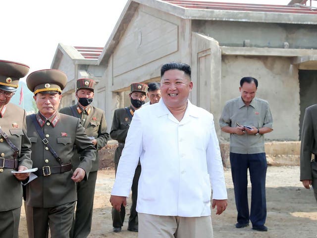 Kim Jong-un visits a chicken farm under construction in a picture released by North Korean state media