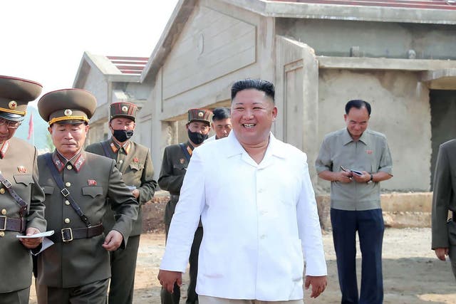 Kim Jong-un visits a chicken farm under construction in a picture released by North Korean state media