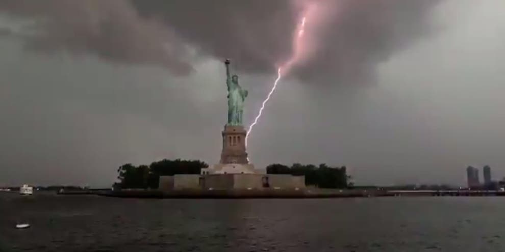 Statue of Liberty struck by lighting in stunning viral video | indy100 ...