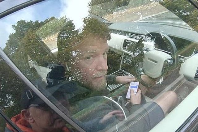 Guy Ritchie is caught on video texting while driving by YouTuber CyclingMikey