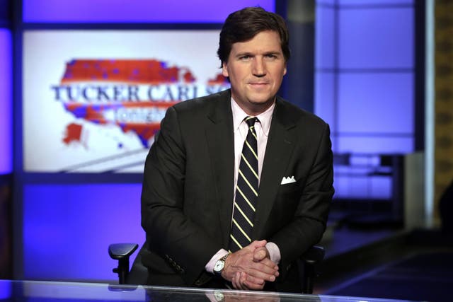 Tucker Carlson fronting his prime-time Fox News show from New York