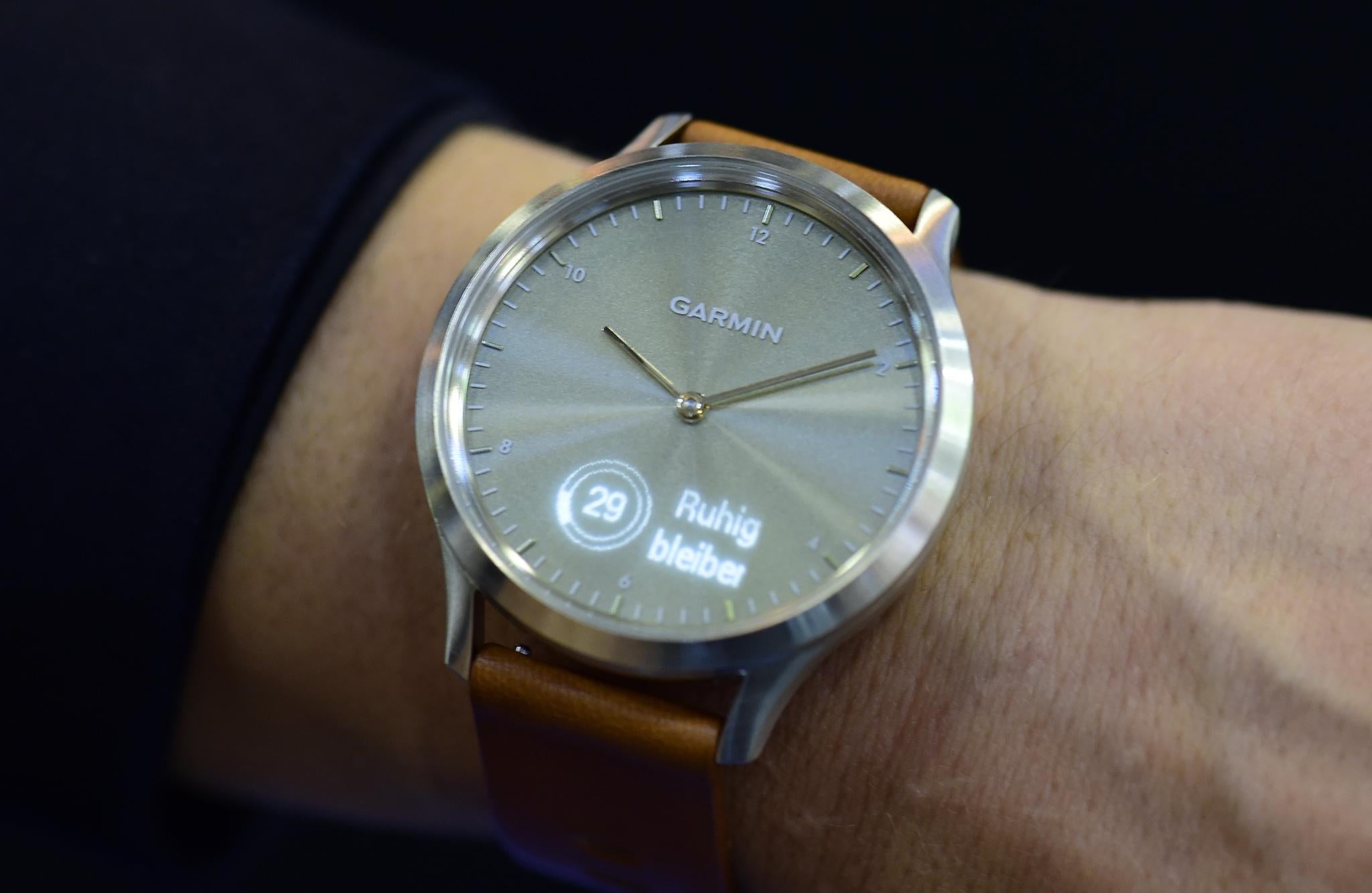 A fair worker presents the "Vivomove HR" smartwatch at the booth of Garmin at the IFA Consumer Electronics Fair in Berlin in Berlin on August 31, 2017