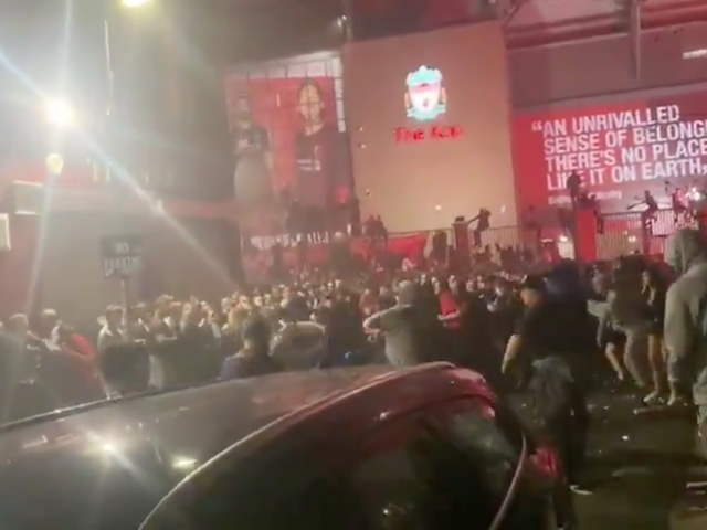 Fans were involved in a mass brawl outside Anfield as Liverpool lifted the Premier League trophy