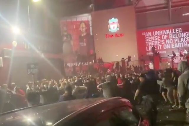 Fans were involved in a mass brawl outside Anfield as Liverpool lifted the Premier League trophy