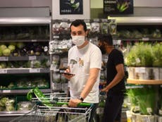 Face mask rule introduced for shops and takeaways in England – live