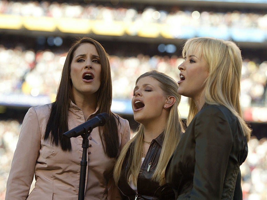 The trio perform the US anthem at the 2003 Super Bowl, months before they were engulfed in controversy (Getty)