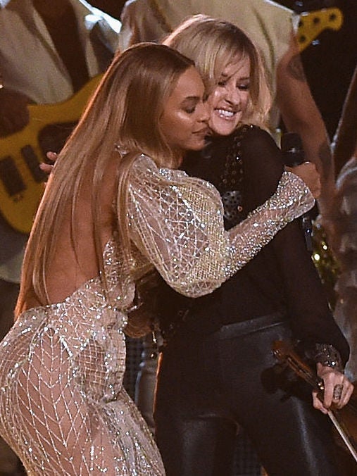 Maguire is embraced by Beyoncé at the 2016 Country Music Awards (Rick Diamond/Getty)