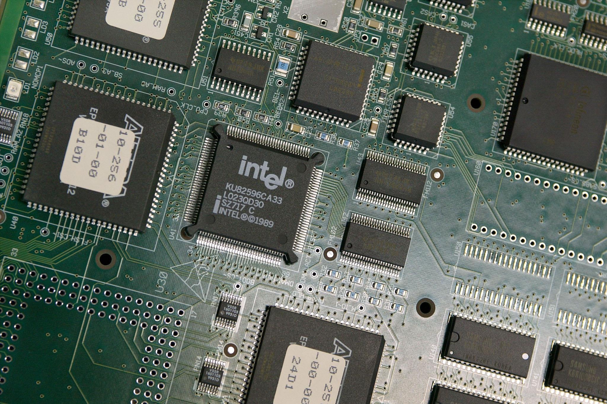 An Intel chip is seen in a circuit board being built at an ECI Telecom high-tech plant January 15, 2003 in Petah Tikva which is located in central Israel