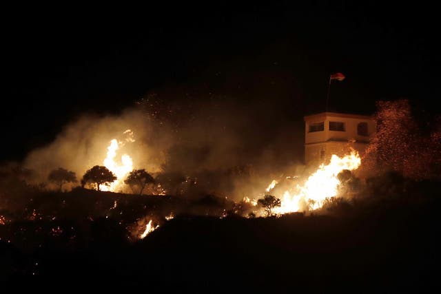 A fire following an Israeli helicopter attack on a Syrian observation post next to the village of Majdal Shams