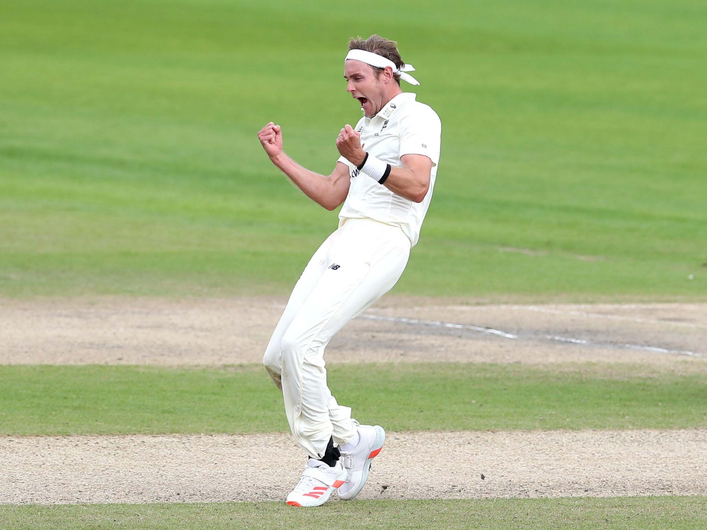 Stuart Broad celebrates taking the wicket of West Indies' Roston Chase