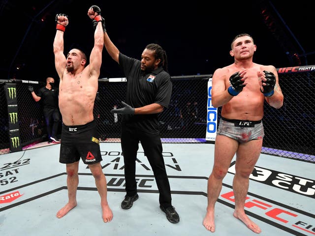 Robert Whittaker celebrates after his victory over Liverpool's Darren Till