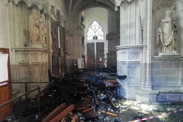 The remains of the burnt organ after falling from the 1st floor during a fire inside the Saint-Pierre-et-Saint-Paul cathedral in Nantes, western France
