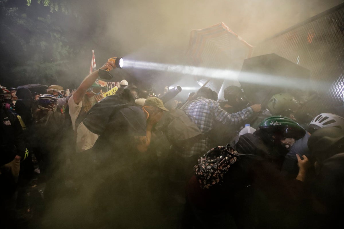 Portland protests: Police declare riot as demonstrators break through ...