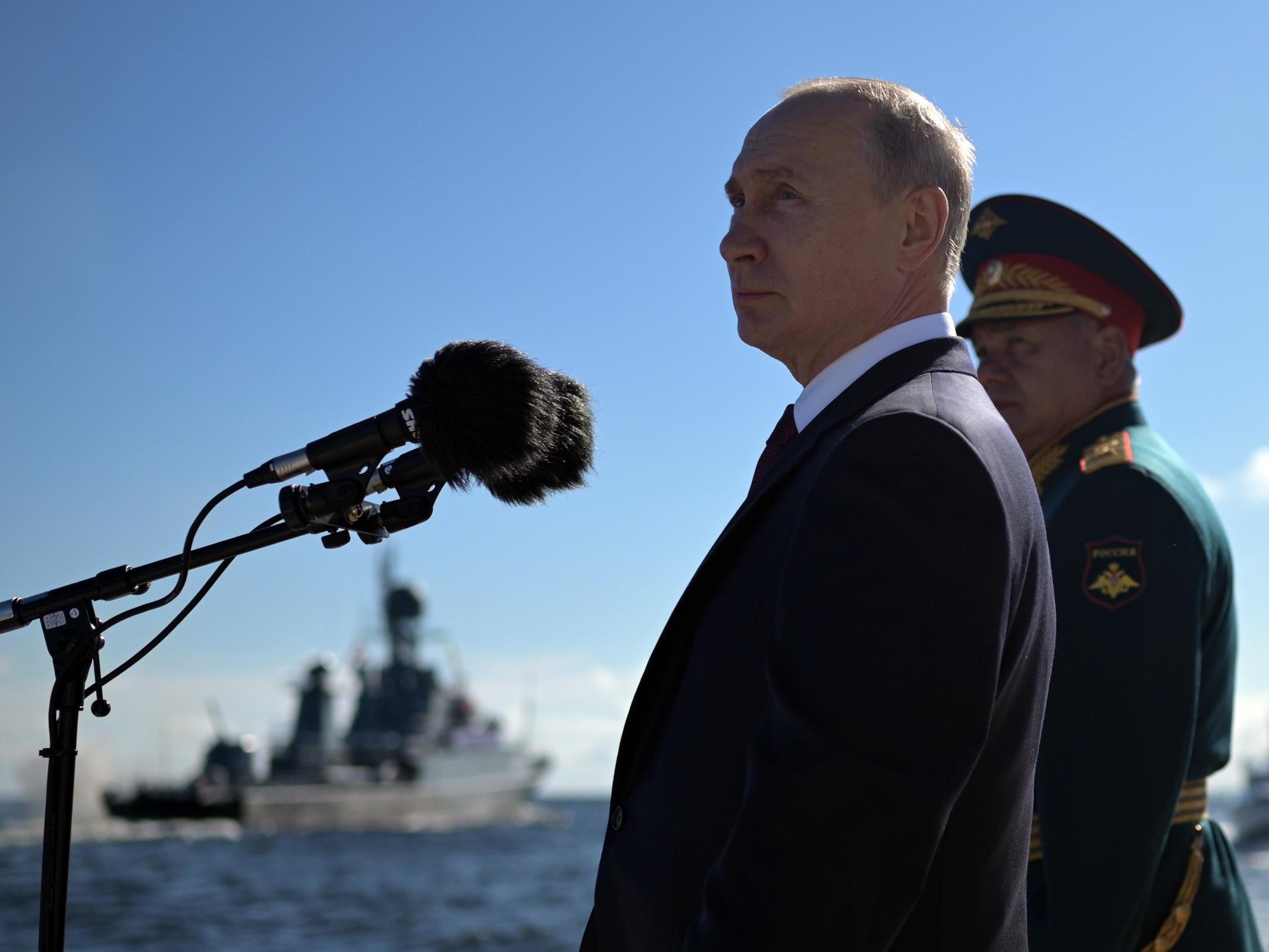 Russian president Vladimir Putin and defence minister Sergei Shoigu attend the 'Russia Navy Day' parade in St. Petersburg