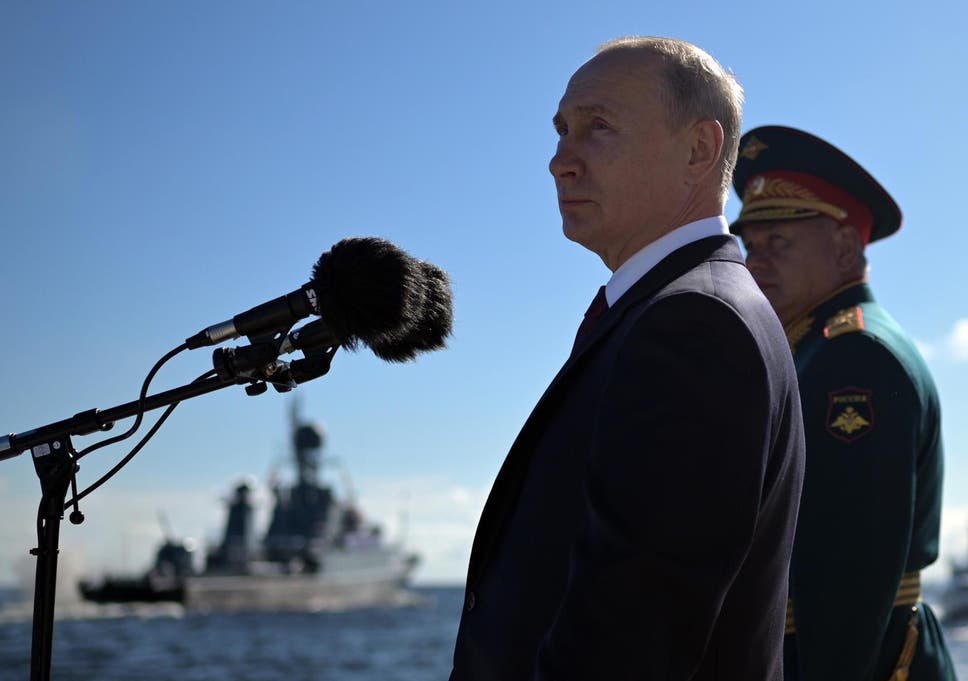 Russian president Vladimir Putin and defence minister Sergei Shoigu attend the 'Russia Navy Day' parade in St. Petersburg