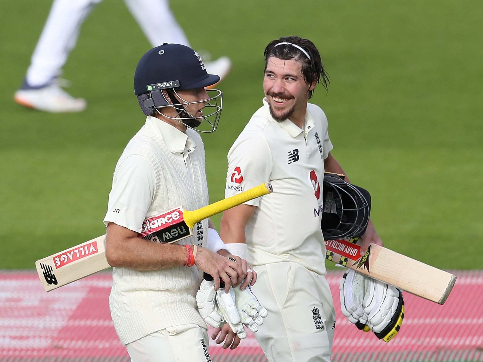 Joe Root and Rory Burns leave the field after declaring on day three