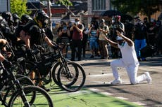 ‘We’re more determined than ever’: Seattle protesters condemn Trump’s dispatch of federal agents to city