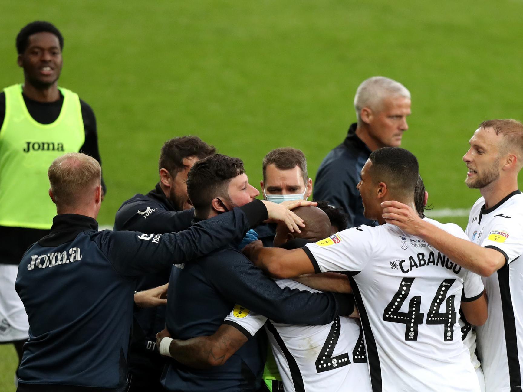 Swansea players celebrate their 1-0 win over Brentford