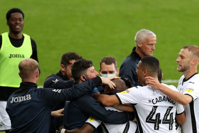 Swansea players celebrate their 1-0 win over Brentford