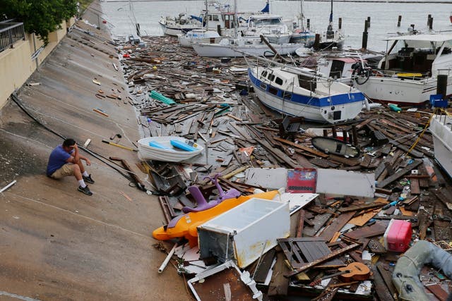 Allen Heath surveys the damage to a private marina in Corpus Christi, Texas after it was hit by Tropical Storm Hanna, which was downgraded from a hurricane as it hit land