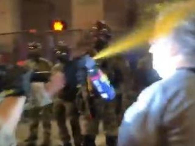 A Vietnam veteran protesting in Portland is sprayed by a federal officer