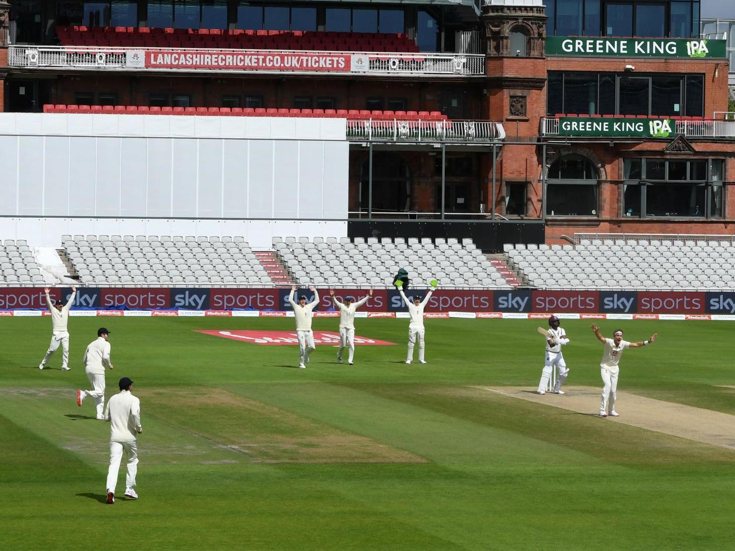 England celebrate at Old Trafford on the final day of their third Test against West Indies