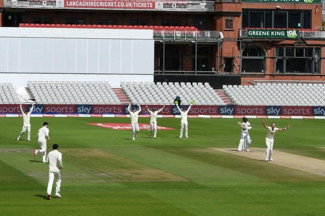England celebrate at Old Trafford on the final day of their third Test against West Indies