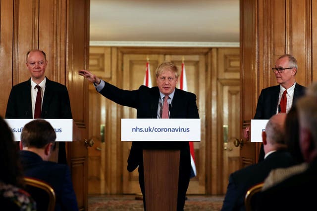 Boris Johnson alongside chief medical officer Chris Whitty (left) and chief scientific adviser Sir Patrick Vallance