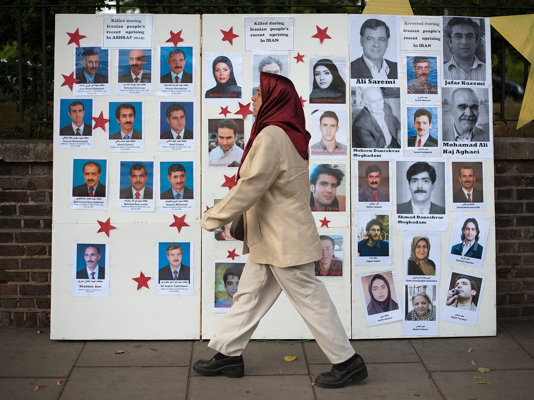 A board showing photographs of people killed in Iran as part of protests in west London to draw attention to human rights abuses in the country