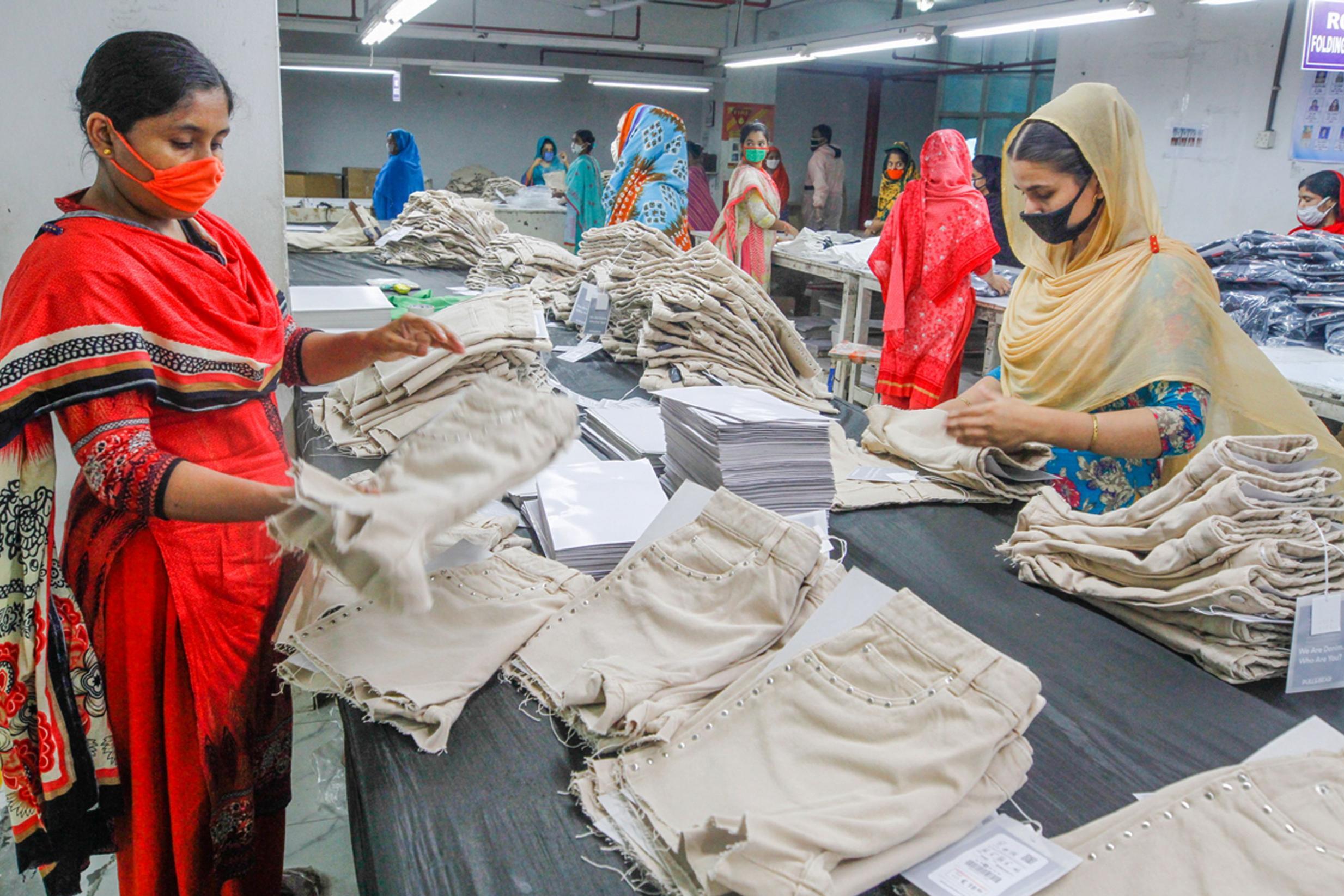 Workers make garments that will be delivered around the world