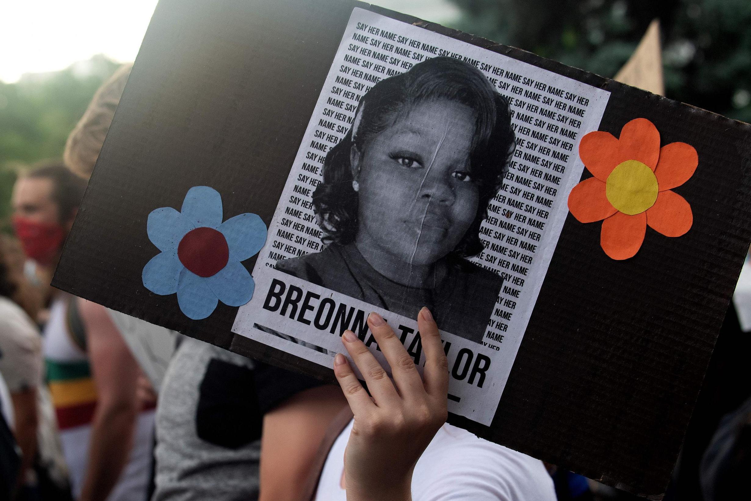 A demonstrator holds a sign with the image of Breonna Taylor during a protest in Denver, Colorado on 3 June 2020.
