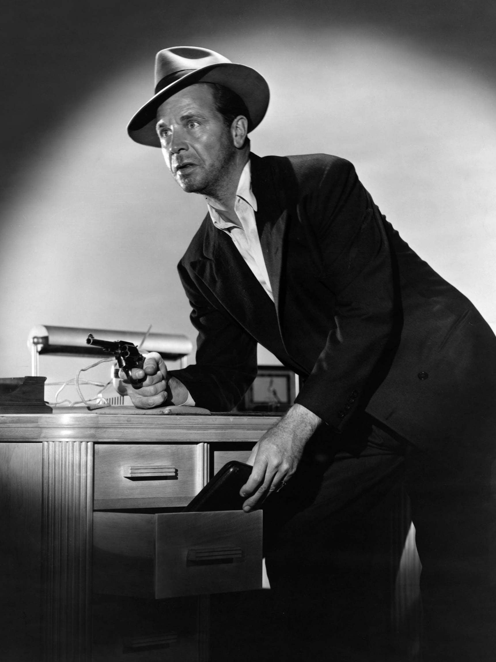 &#13;
Dick Powell as Philip Marlowe in ‘Farewell My Lovely’ in 1944 &#13;