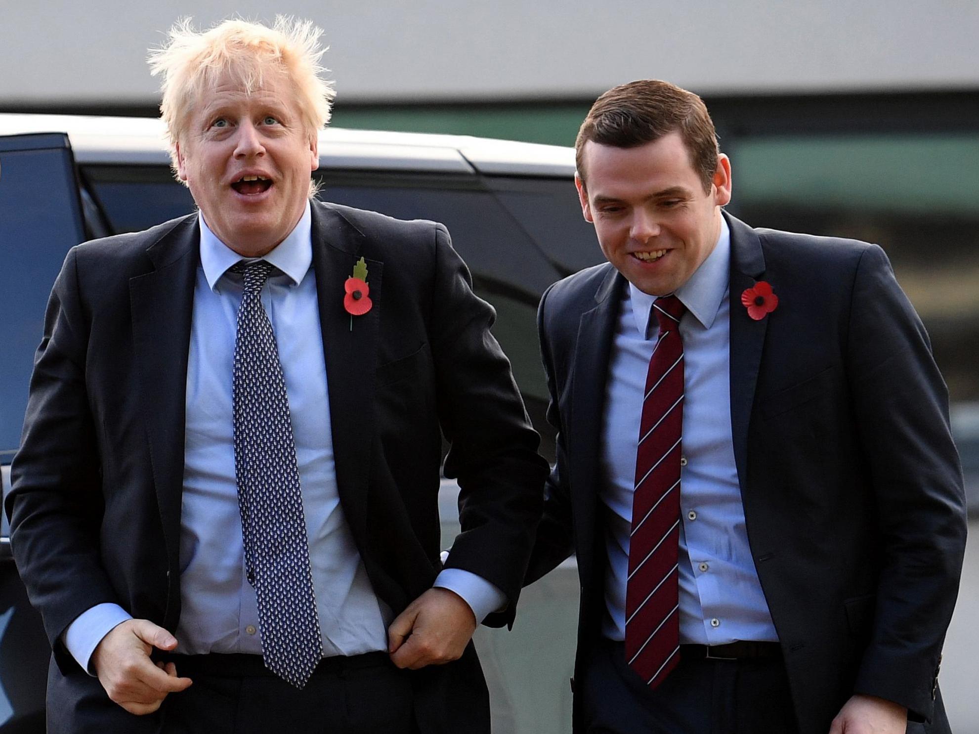 Boris Johnson with Douglas Ross in the MP’s Moray constituency (POOL/AFP via Getty Images)