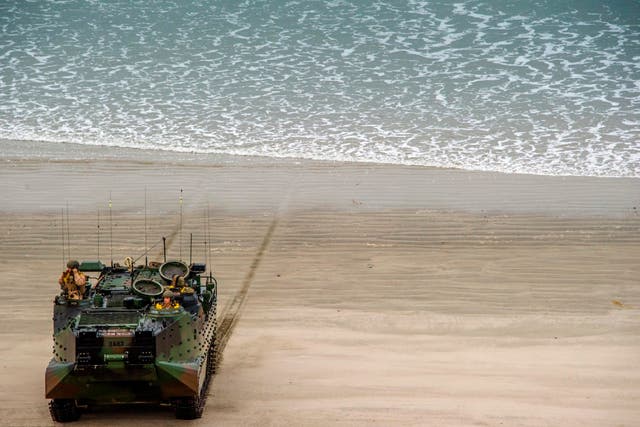 An amphibious assault vehicle lands with US marines during an exercise at Camp Pendleton, California