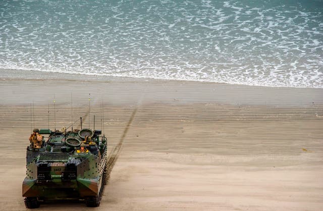 An amphibious assault vehicle lands with US marines during an exercise at Camp Pendleton, California