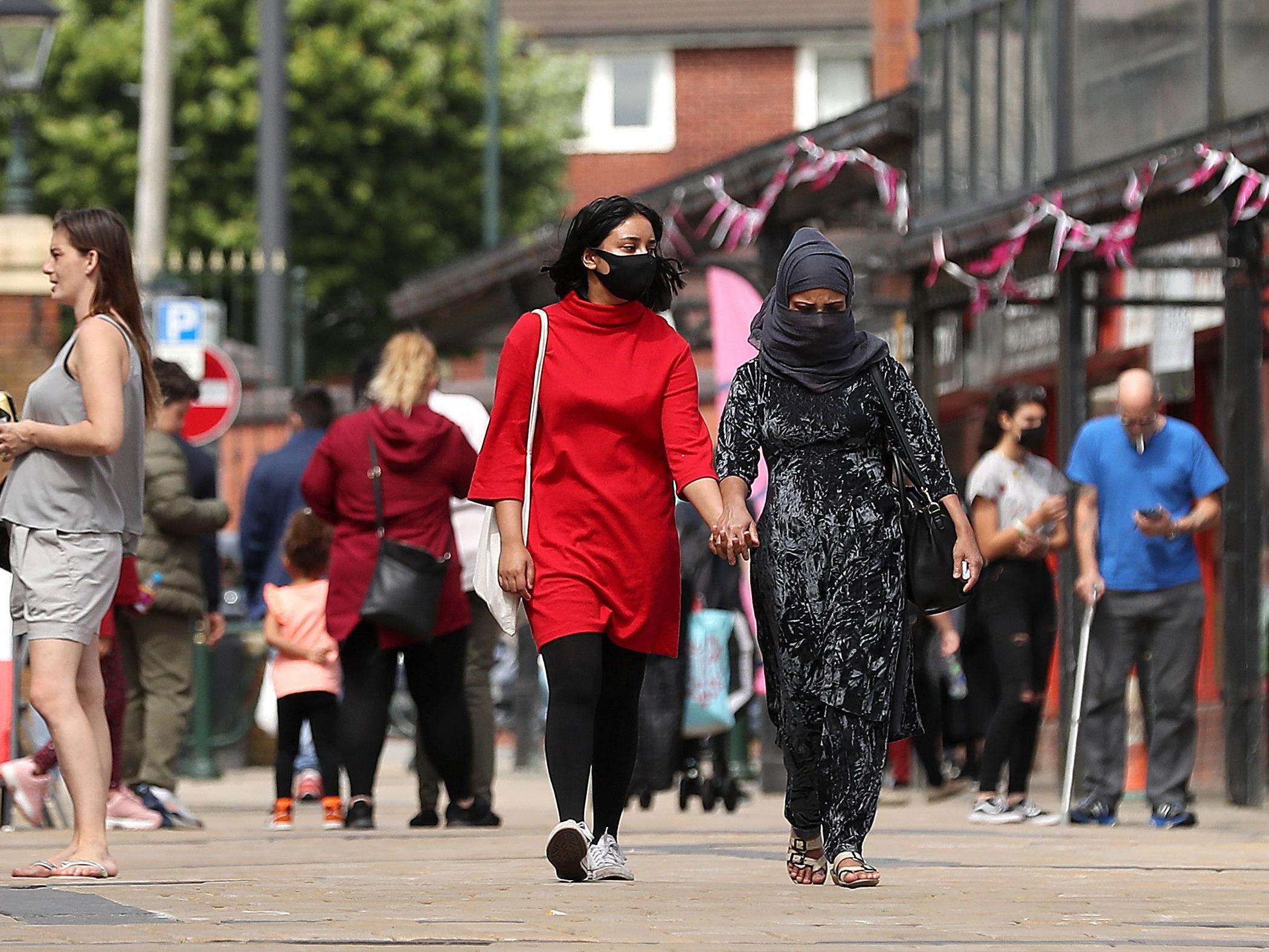 Shoppers in infection-hit Oldham where only 47 per cent of coronavirus contacts are being traced