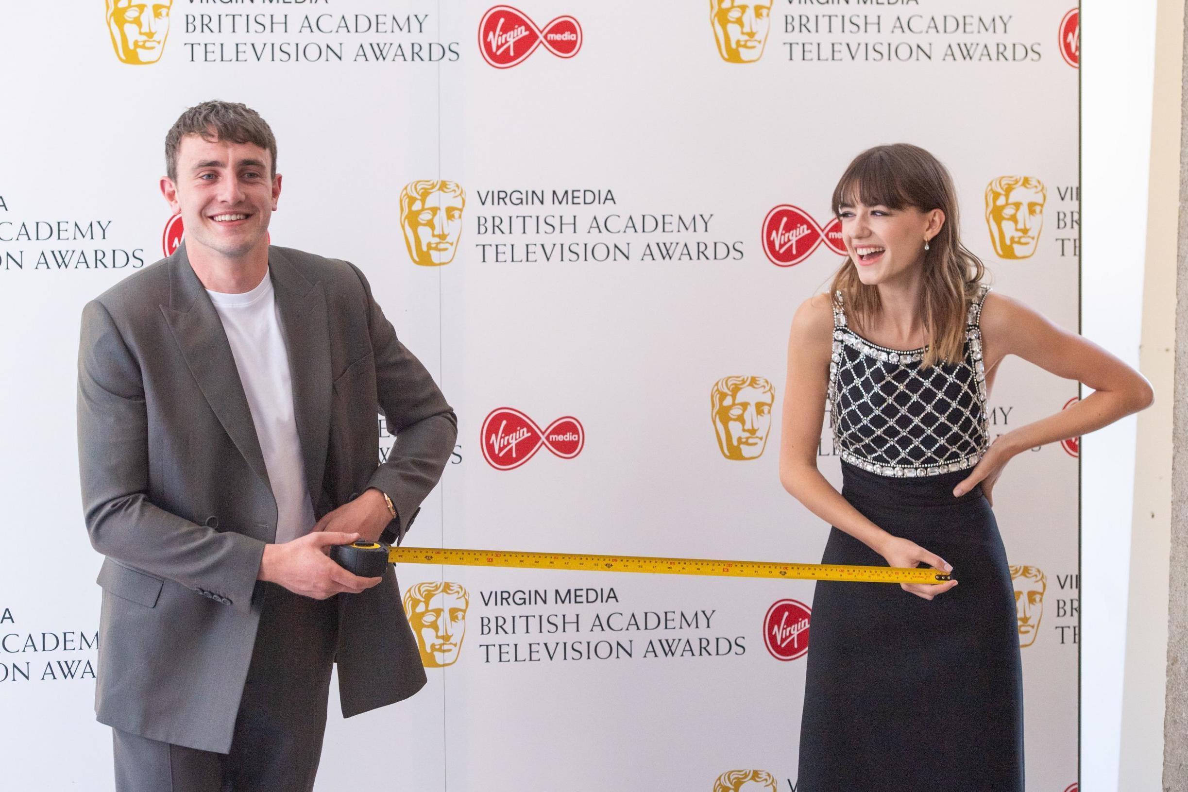 Normal People co-stars Paul Mescal and Daisy Edgar-Jones pose with tape measure at Bafta TV Awards