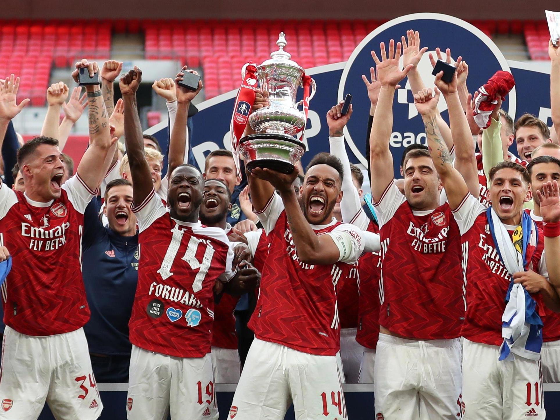 Pierre-Emerick Aubameyang wins the FA Cup for Arsenal – then drops the trophy before he lifts it