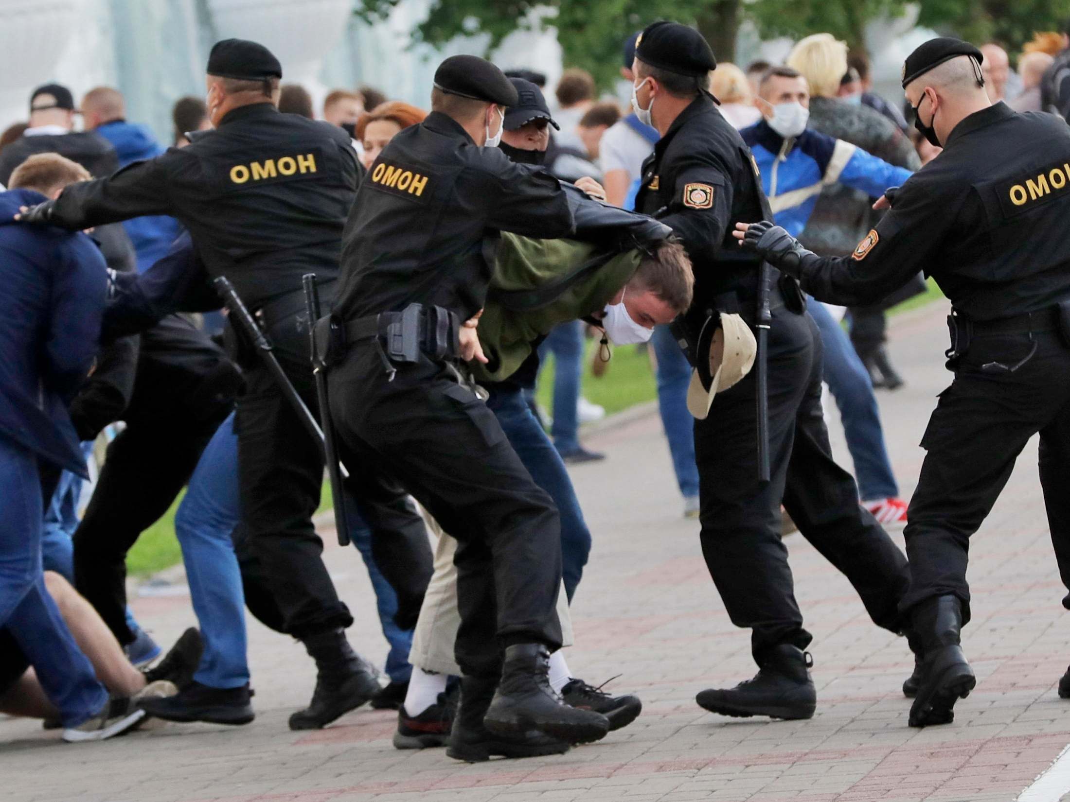 Police officers detain protests during a rally in Minsk last month