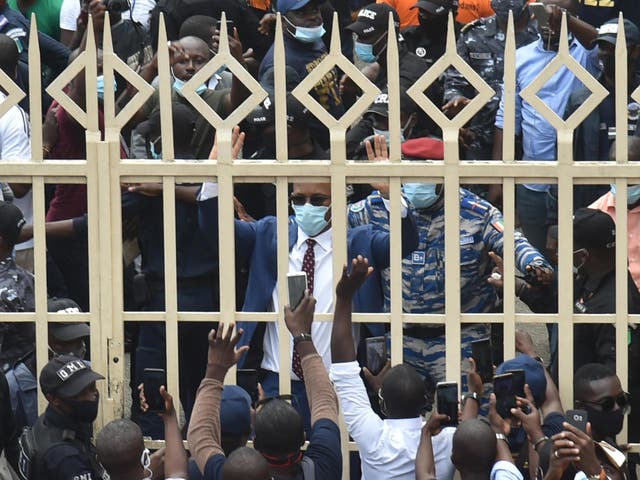 Didier Drogba greets supporters after submitting his application to be president of the Ivorian Football Federation