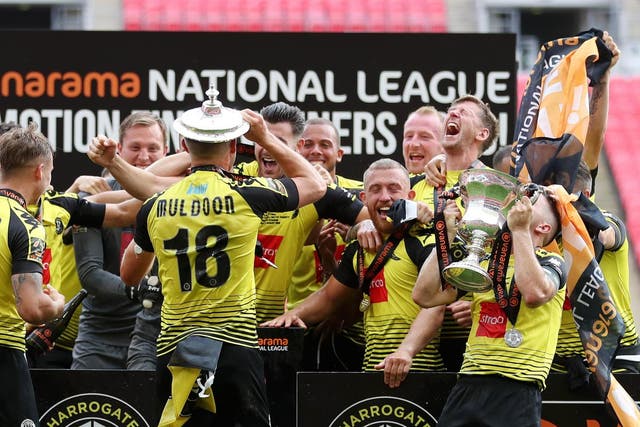 Harrogate Town players celebrate their historic win at Wembley Stadium