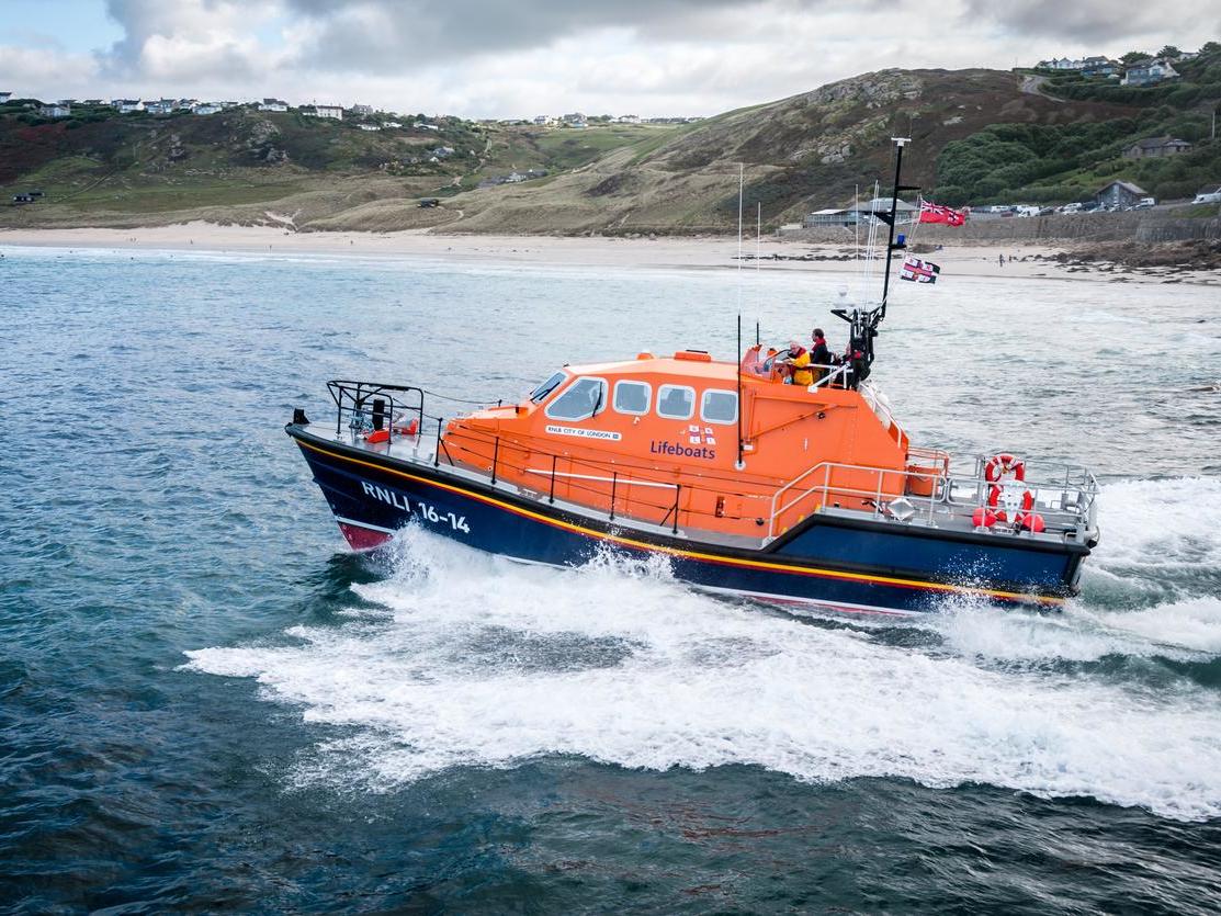 Lifeboat crews said the boy had done exactly what everyone should do when swept out to sea